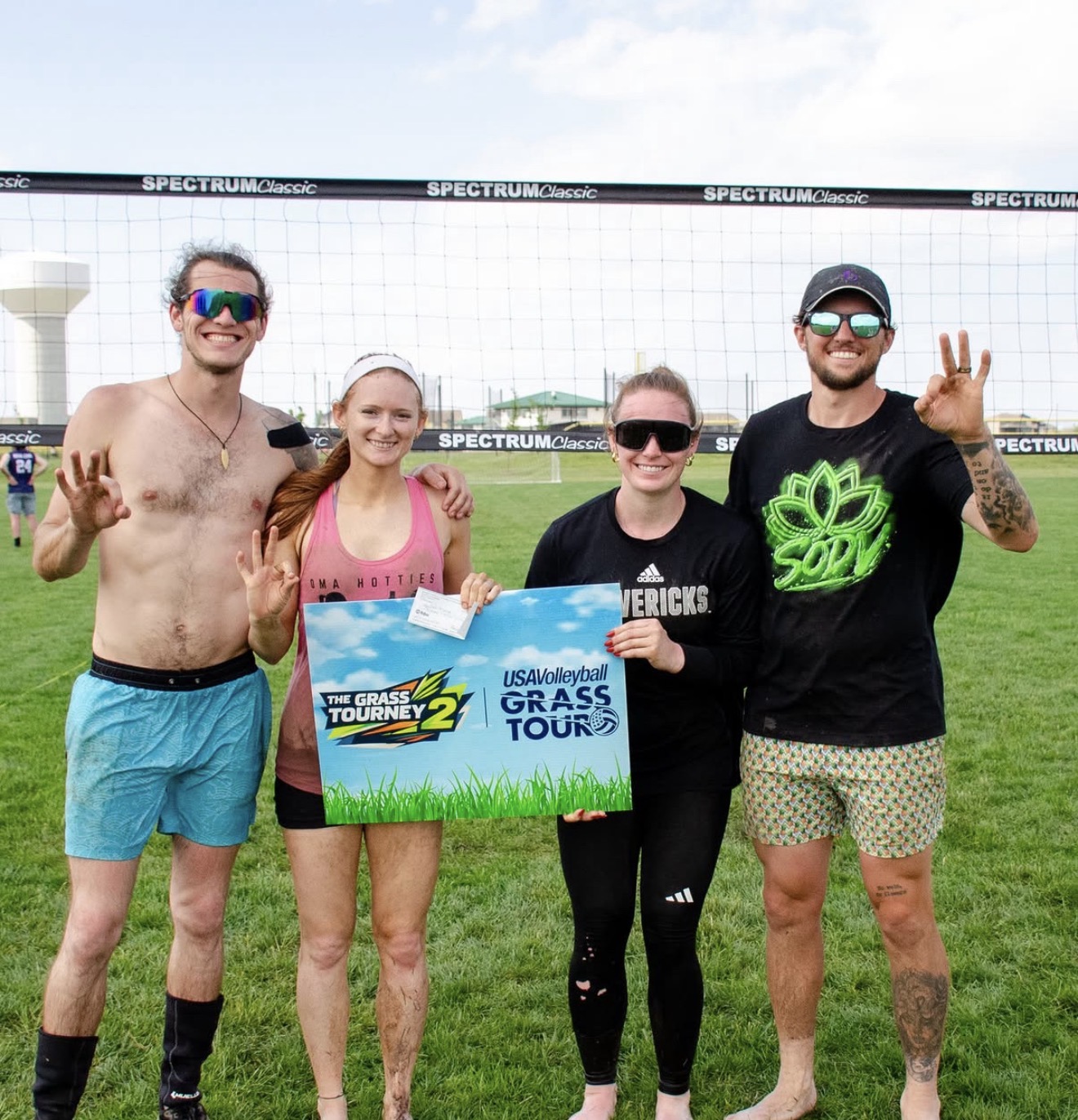 Omahotties co-ed team with their Grass Tourney winners check